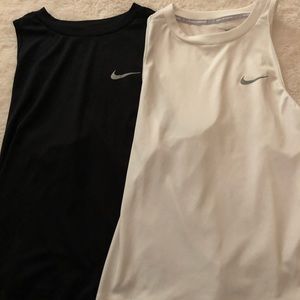 TWO NIKE RUNNING TANKS